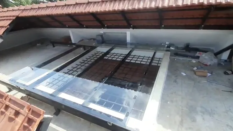 Retractable roof panels opening above an entrance